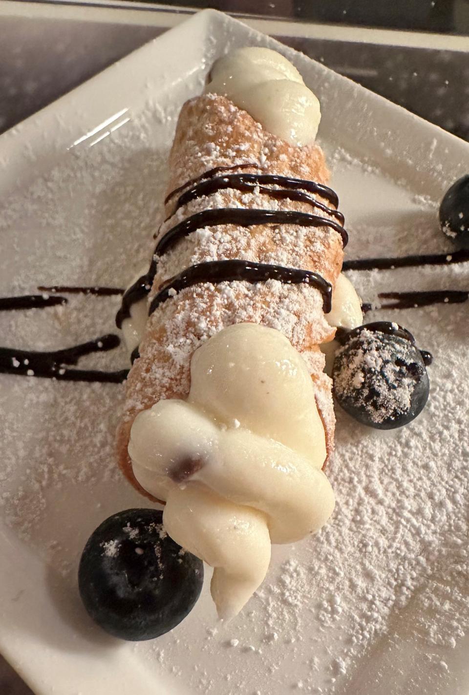 A mini cannoli is a sweet, petite dessert available as part of the Burrata Italian Kitchen Mother's Day meal. Preorder today.