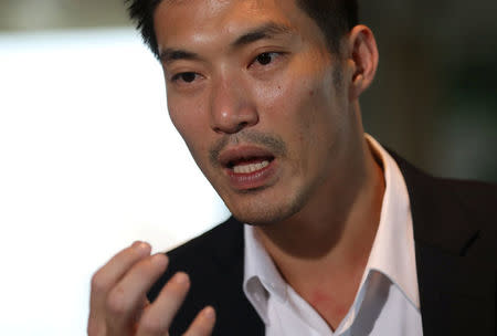 FILE PHOTO: Thanathorn Juangroongruangkit, founder of Thailand's Future Forward Party, speaks during an interview at the Reuters office in Bangkok, Thailand March 19, 2018. Picture taken March 19, 2018. REUTERS/Soe Zeya Tun/File Photo