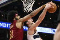 Cleveland Cavaliers center Jarrett Allen (31) and Washington Wizards forward Deni Avdija, right, battle for the ball during the first half of an NBA basketball game, Monday, Feb. 6, 2023, in Washington. (AP Photo/Nick Wass)