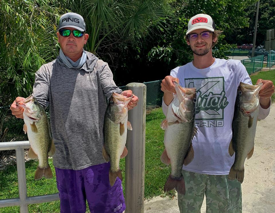 Chris Fox, left, and Gabe Fox had 19.26 pounds to win first place during the Polk County Bass AssassinÕs tournament July 16 at Banana Lake. 