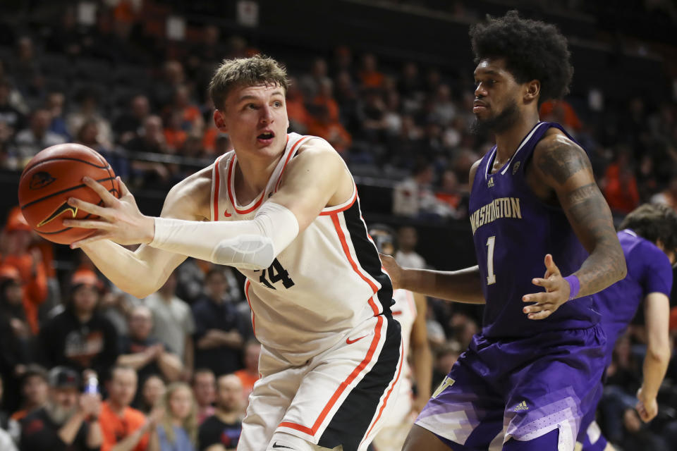 Oregon State forward Tyler Bilodeau (34) grabs a rebound next to Washington forward Keion Brooks Jr. (1) during the second half of an NCAA college basketball game Saturday, Feb. 10, 2024, in Corvallis, Ore. (AP Photo/Amanda Loman)