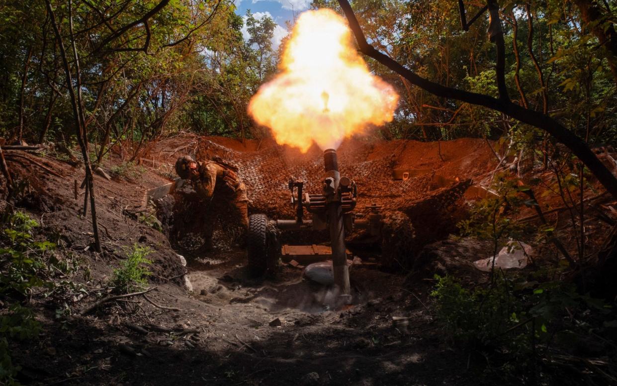 Servicemen of Ukraine's 93rd Mechanised Brigade fire a French MO-120-RT heavy mortar at the Russian forces on the front line near the city of Bakhmut in Ukraine's Donetsk region on Wednesday, May 22, 2024.