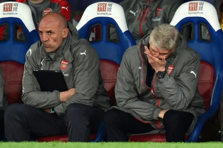 Arsenal fans subjected manager Arsene Wenger (R) to a stream of abuse and calls to resign as the team lost to Crystal Palace