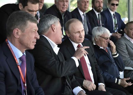 Formula One - F1 - Russian Grand Prix - Sochi, Russia - 30/04/17 - Russian President Vladimir Putin (3rd L) listens to F1 chairman Chase Carey during the race. Sputnik/Alexei Nikolsky/Kremlin via REUTERS