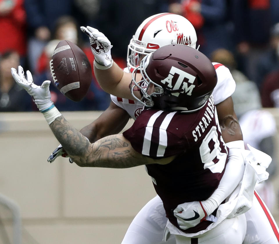 FILE - In this Nov. 10, 2018, file photo, Texas A&M tight end Jace Sternberger (81) catches a pass for a first down as Mississippi defensive back Myles Hartsfield defends during the first half of a game in College Station, Texas. Sternberger was named to the 2018 AP All-America NCAA college football team, Monday, Dec. 10, 2018.(AP Photo/David J. Phillip, File)