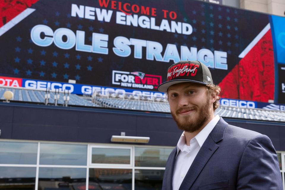 New England Patriots NFL football first-round draft pick offensive linesman Cole Strange walks in Gillette Stadium following a news conference, Friday, April 29, 2022, in Foxborough, Mass. (AP Photo/Michael Dwyer)