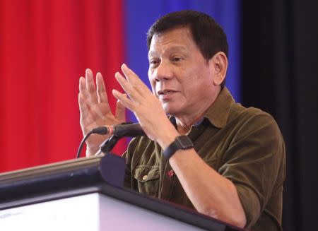 Philippine President-elect Rodrigo Duterte speaks during a conference with businessmen in Davao city, southern Philippines, June 21, 2016. REUTERS/Lean Daval Jr/File Photo