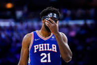 Philadelphia 76ers' Joel Embiid adjusts his mask during the second half of Game 6 of an NBA basketball second-round playoff series against the Miami Heat, Thursday, May 12, 2022, in Philadelphia. (AP Photo/Matt Slocum)