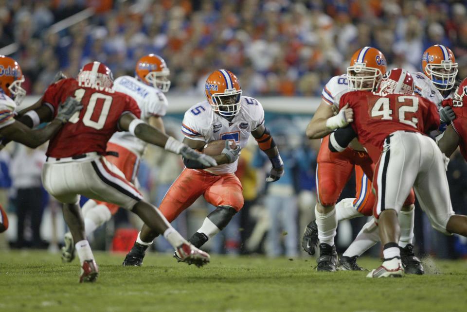 JACKSONVILLE, FL - NOVEMBER 02:  Running Back Earnest Graham #5 of the Florida Gators runs for yards during the game against the Georgia Bulldogs at Alltel Stadium on November 2, 2002 in Jacksonville, Florida.  Gators won 20-13  (Photo by Andy Lyons/Getty Images)