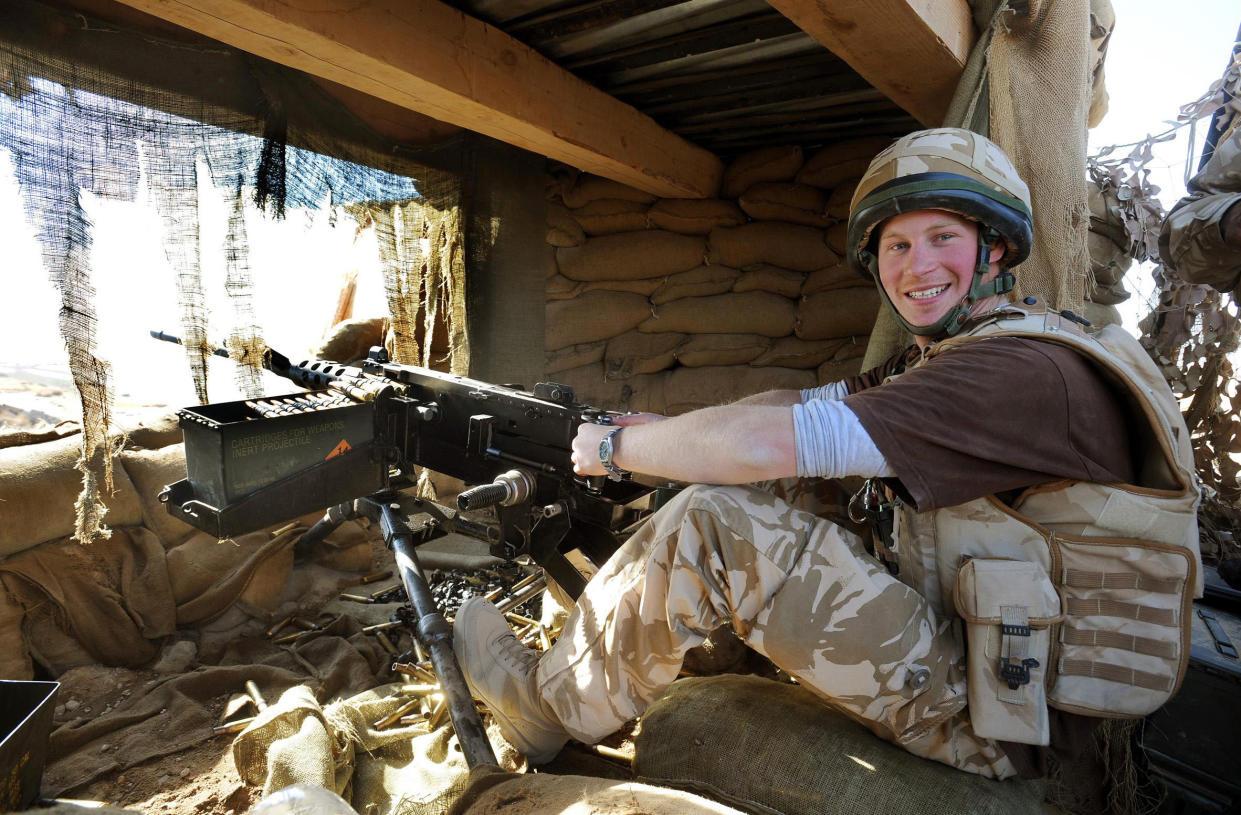 Britain's Prince Harry mans a 50 calibre machine gun on the observation post at JTAC Hill, close to FOB Delhi (forward operating base), in Helmand province, southern Afghanistan January 2, 2008. The government is reviewing Prince Harry's presence in Afghanistan, where he has been deployed with the army for 2-1/2 months, following leaks in the international media that he was deployed there, the Defence Ministry said on February 28, 2008.  Photograph taken January 2, 2008.     REUTERS/John Stillwell/Pool   (AFGHANISTAN)