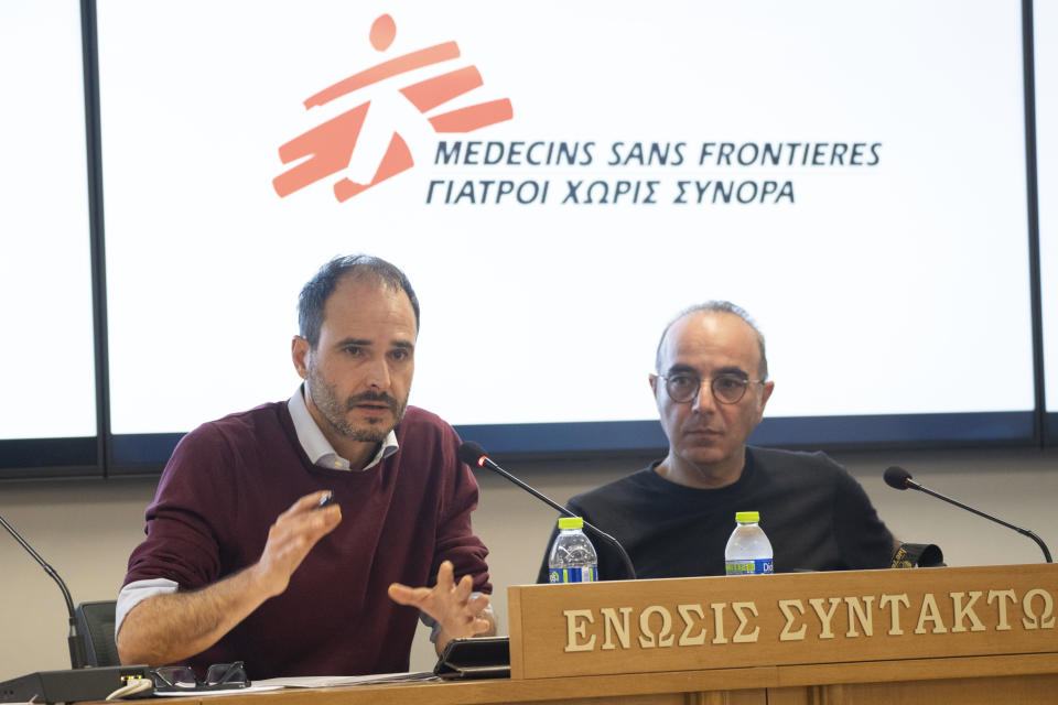 International President of MSF Christos Christou, left, speaks next to Greek journalist Panos Charitos, during a news conference organised by the Doctors Without Borders, in Athens, on Thursday, Nov. 2, 2023. A leading international medical charity says it has received scores of testimonies over the past two years from migrants that point to a "recurring practice" of alleged secret, illegal and often brutal deportations back to Turkey from two eastern Greek islands. (AP Photo/Petros Giannakouris)
