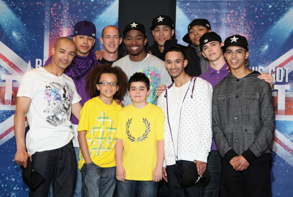 LONDON, ENGLAND - MAY 31:  Members of dance troupe Diversity (Back row L-R)  Ian McNaughton, Warren Russell, Terry Smith, Ike Ezekwugo, Ashley Banjo, Jordan Banjo (Front Row L-R) Sam Craske, Perri Kiely, Mitchell Craske, Jamie McNaughton and Matthew McNaughton attend a press conference after winning the live final of Britain's Got Talent at Sony Headquarters on May 31, 2009 in London, England.  (Photo by Tim Whitby/Getty Images)