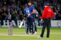 Britain Cricket - England v Sri Lanka - First One Day International - Trent Bridge - 21/6/16 England's Liam Plunkett (C) celebrates with Chris Woakes after hitting a six from the last ball to draw the match Action Images via Reuters / Ed Sykes Livepic