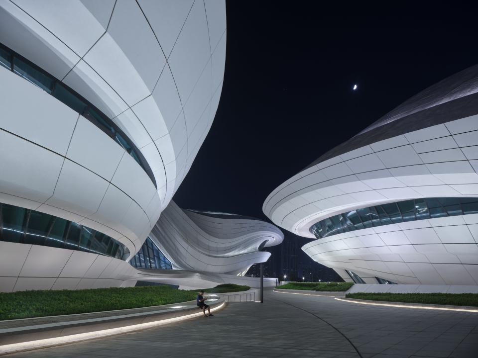 The space has a ribbon-like walkway that winds through the various buildings that make up the complex.