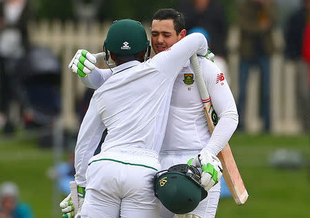 Cricket - Australia v South Africa - Second Test cricket match - Bellerive Oval, Hobart, Australia - 14/11/16 South Africa's Quinton de Kock hugs team mate Temba Bavuma as he celebrates reaching his century. REUTERS/David Gray