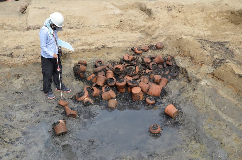 Handout photo shows Remains of various pieces of pottery are at an excavations site called 'Umeda Tomb", at a construction site for a train station, in Osaka, western Japan