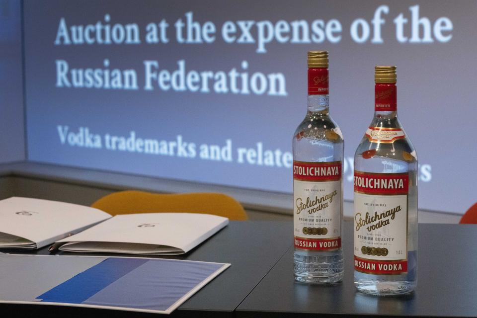 Two vodka bottles are displayed prior to a public auction of the Benelux rights to Stolichnaya and 17 other vodka brands owned by the Russian state, part of efforts to make Moscow pay for seizing the assets of oil company Yukos, in The Hague, Netherlands, Tuesday, Dec. 6, 2022. (AP Photo/Peter Dejong)