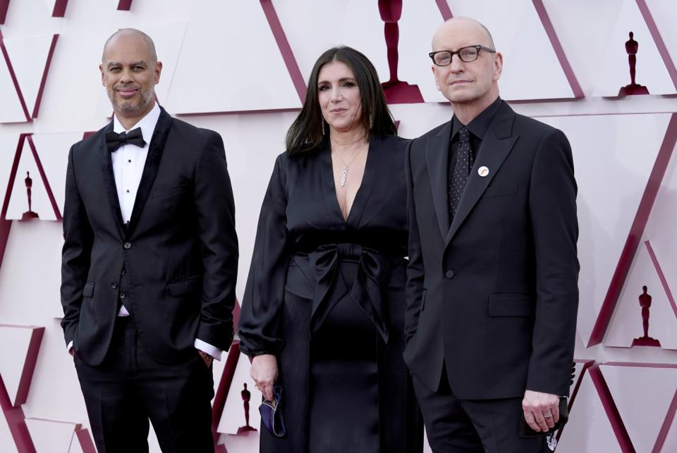 Jesse Collins, Stacey Sher and Steven Soderbergh wear all black on the red carpet.