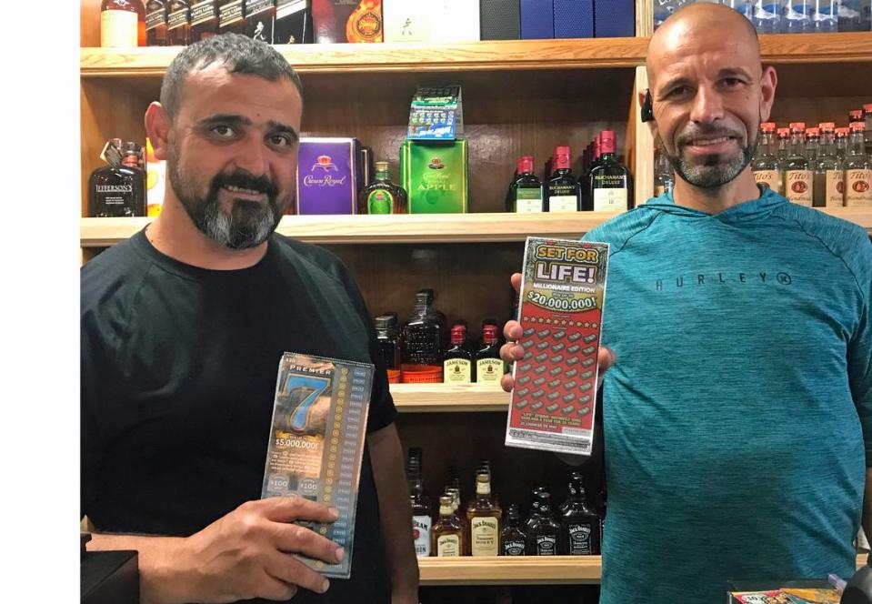 Sean Farhoud, general manager of the Cambria General Store, left, and store co-owner Benan Akkare hold California State Lottery tickets on Wednesday, Sept. 13, 2023. Farhoud sold a California lottery Scratchers ticket worth $5 million on Aug. 9, 2023.