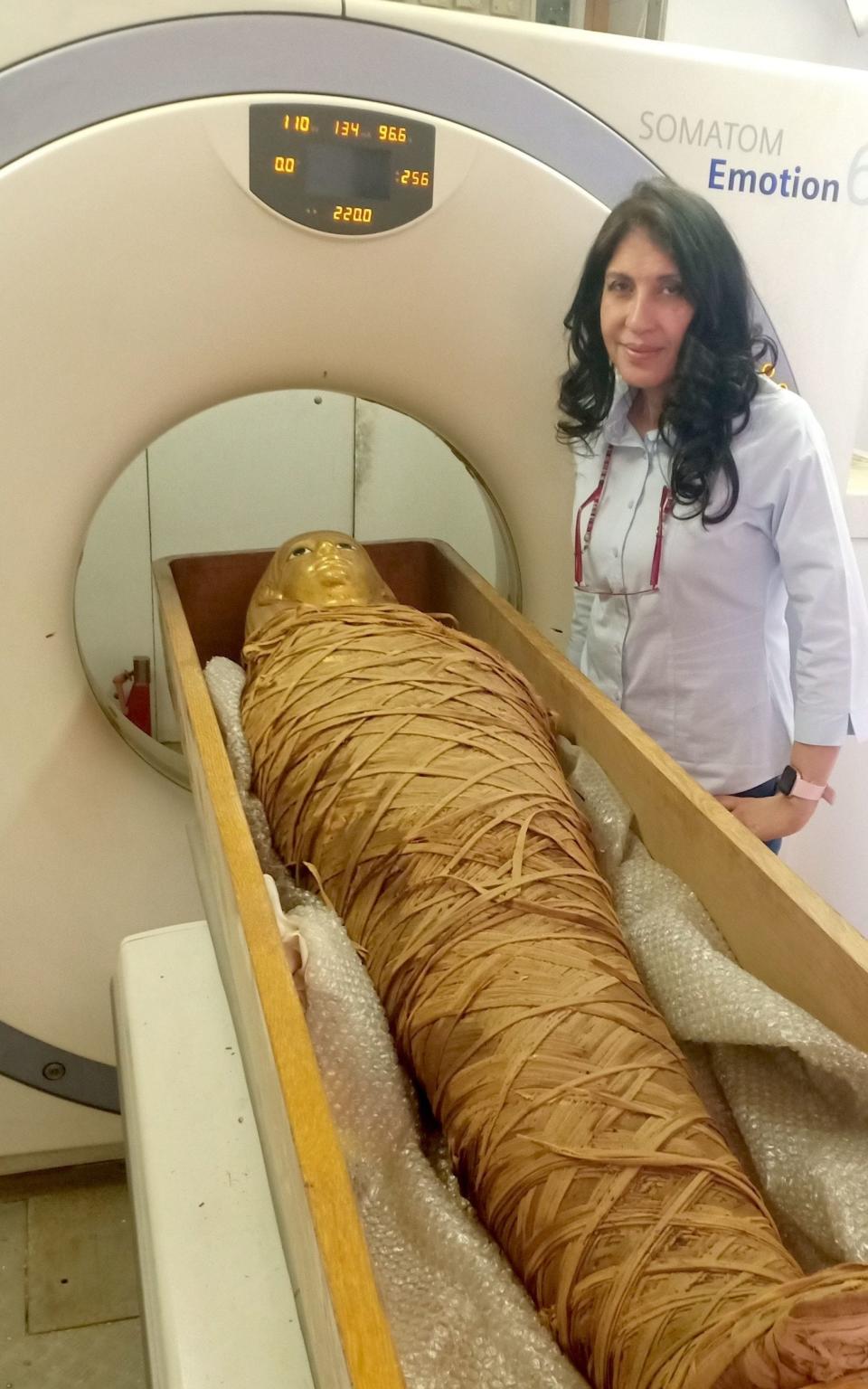 Dr Sahar Saleem, professor of radiology at the Faculty of Medicine at Cairo University and the radiologist of the Egyptian Mummy Project, scanning the perfectly wrapped mummified body of Amenhotep I - Dr Sahar Saleem/University of Cairo