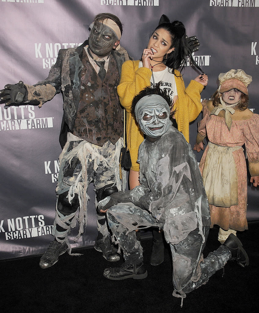 Vanessa Hudgens was freaked out to say the least when the monsters at Knott’s Scary Farm crowded in for a pic with her. (WireImage)