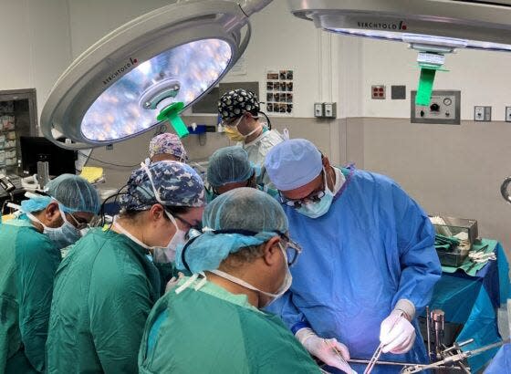 Dr. Chirag Desai, Dr. Sorhab Kapoor, and the rest of the abdominal transplant surgery team perform a partial liver transplant on Meredith Steihl, of Fayetteville, on March 1.