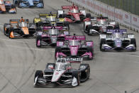 Josef Newgarden (2) leads the field into turn one during the IndyCar Detroit Grand Prix auto race on Belle Isle in Detroit, Sunday, June 5, 2022. (AP Photo/Paul Sancya)