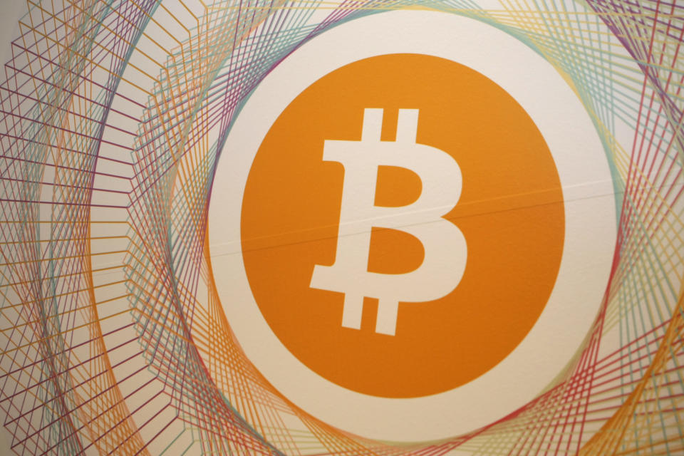 The Bitcoin logo in the first Italian Bitcoin crypto currency shop ‘Bitcoin Compro Euro’ (meaning I Buy Euro), in Rovereto, northern Italy. Photo: PIERRE TEYSSOT/AFP/Getty Images