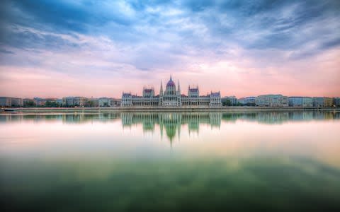 Sunrise by the Hungarian Parliament - Credit: Getty