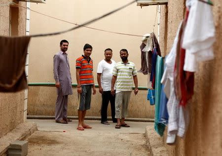 Asian workers gather at their accommodation at Qadisiya labour camp, Saudi Arabia August 17, 2016. Picture August 17, 2016. REUTERS/Faisal Al Nasser