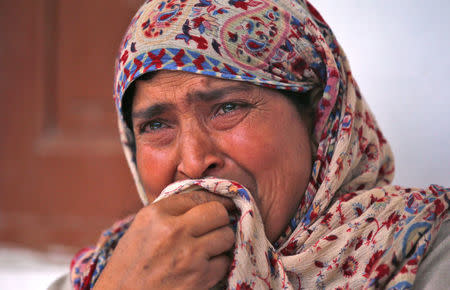 Rafiqa, mother of Shaista Hameed who was killed by a stray bullet during an encounter, cries during an interview with Reuters in Lalhar, south of Srinagar May 16, 2016. REUTERS/Danish Ismail