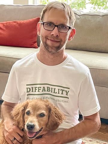 <p>Michael Kutcher Instagram</p> Ashton Kutcher's twin brother Michael poses with a dog.