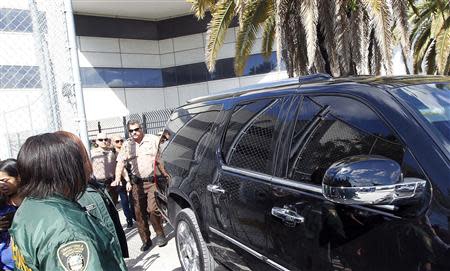 The vehicle carrying teen pop star Justin Bieber departs from a Miami-Dade County jail in Miami, Florida January 23, 2014. REUTERS/Andrew Innerarity