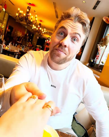<p>Mikaela Shiffrin/Instagram</p> Aleksander Aamodt Kilde holding Mikaela Shiffrin's hand