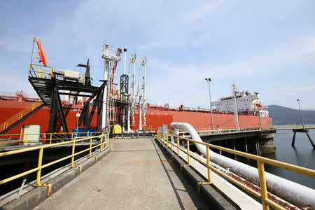 A tanker docks at Westridge Terminal, the loading area for Kinder Morgan's Trans Mountain pipeline in Burnaby, British Columbia, Canada in a May 10, 2013 file photo. Kinder Morgan Canada/Handout via REUTERS