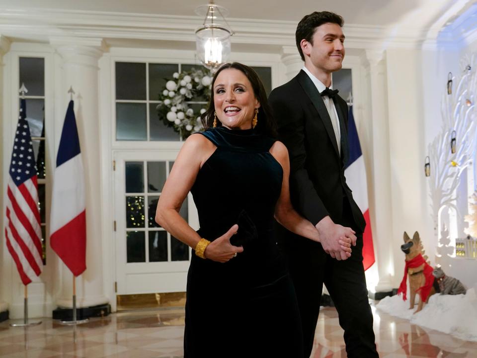 Actress Julia Louis-Dreyfus and her son actor Charlie Hall arrive for the State Dinner with President Joe Biden and French President Emmanuel Macron at the White House in Washington, Thursday, Dec. 1, 2022.