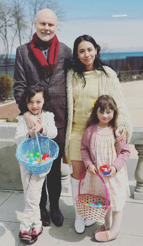 <p>Chloe Mendel/Instagram</p> Billy Corgan (left) and wife Chloe Mendel (right) with their son Augustus and daughter Philomena