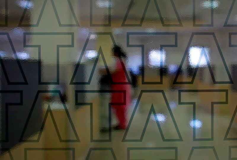 An employee of Tata Consultancy Services (TCS) works inside the company headquarters in Mumbai