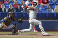 Philadelphia Phillies' Bryce Harper strikes in front of Toronto Blue Jays catcher Danny Jansen during the ninth inning of a baseball game Sunday, May 16, 2021, in Dunedin, Fla. (AP Photo/Mike Carlson)