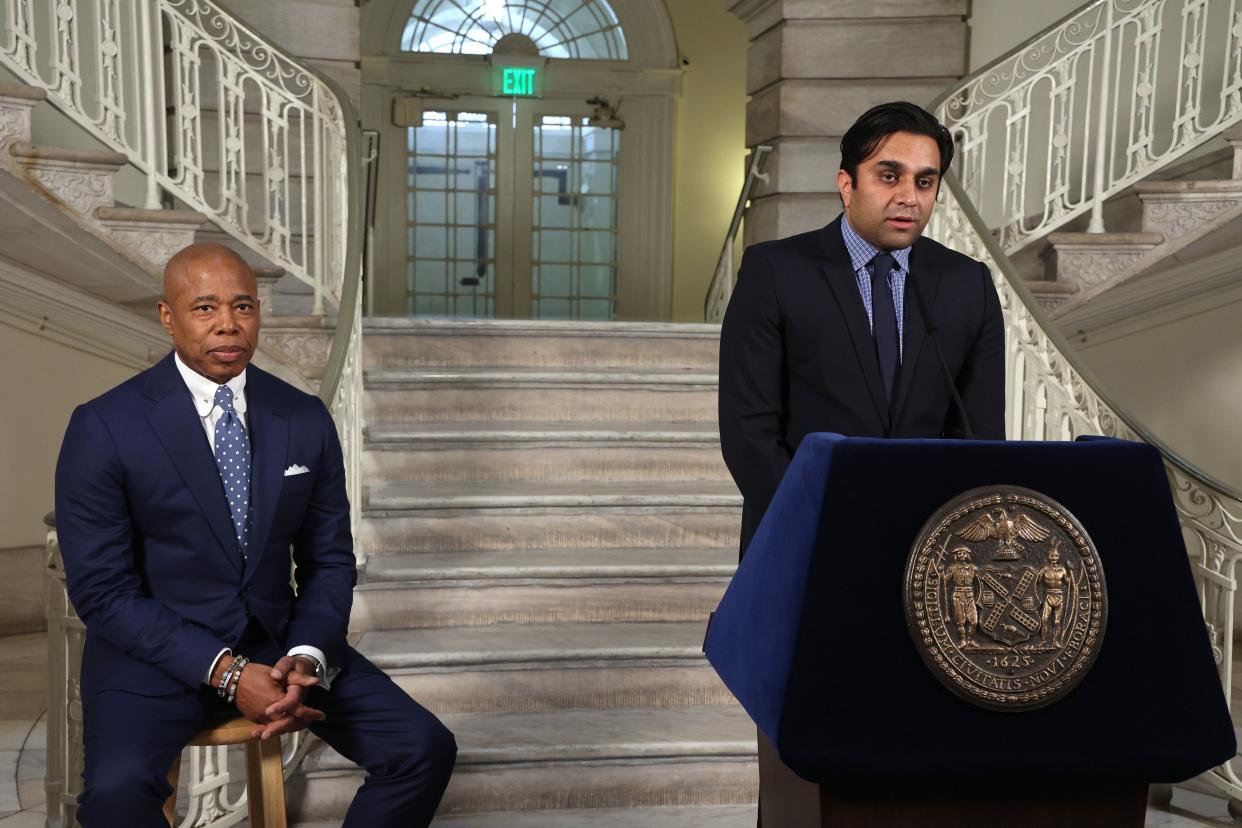 New York City Health Commissioner Dr. Ashwin Vasan  (at podium) speaks during a press conference with New York City Mayor Eric Adams (left) in March 2022. 