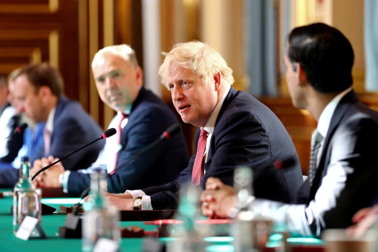 Back to work: Boris Johnson and his team meet at the Foreign Office today: Getty Images