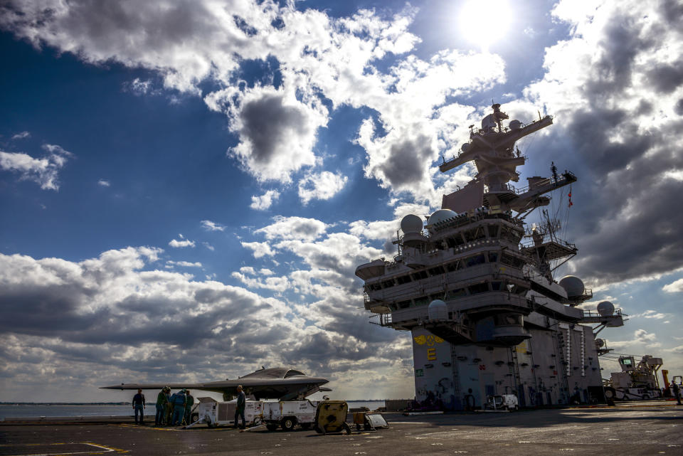 ATLANTIC OCEAN - MAY 13: In this handout released by the U.S. Navy, Northrop Grumman personnel conduct pre-operational tests on an X-47B Unmanned Combat Air System (UCAS) demonstrator on the flight deck of the aircraft carrier USS George H.W. Bush (CVN 77) May 13, 2013 in the Atlantic Ocean. George H.W. Bush is scheduled to be the first aircraft carrier to catapult-launch an unmanned aircraft from its flight deck. The Navy plans to have unmanned aircraft on each of its carriers to be used for surveillance and be armed and used in combat roles. (Photo by Mass Communication Specialist 3rd Class Kevin J. Steinberg//U.S. Navy via Getty Images)