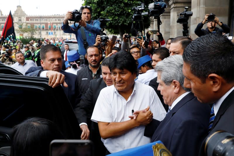Bolivia's ousted president Evo Morales leaves after a ceremony where he was recognized as a distinguished guest, outside the town hall in Mexico City