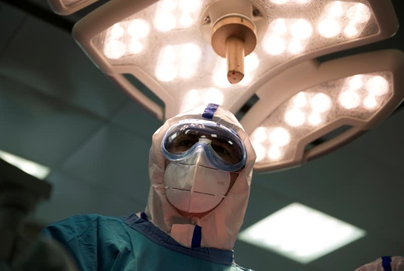 FILE PHOTO: Medical specialists treat patients infected with the coronavirus disease in a hospital in Moscow