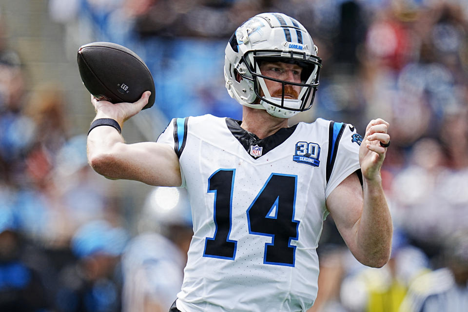 Carolina Panthers quarterback Andy Dalton passes against the Cincinnati Bengals during the first half of an NFL football game, Sunday, Sept. 29, 2024, in Charlotte, N.C. (AP Photo/Rusty Jones)