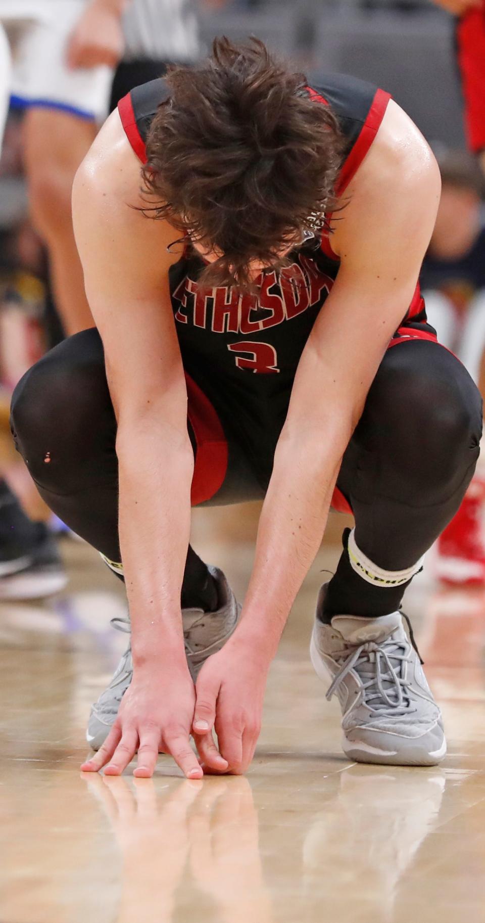 Bethesda Christian Patriots Sam Mlagan (3) reacts after the IHSAA Class 1A boy’s basketball state championship against the Fort Wayne Canterbury Cavaliers, Saturday, March 30, 2024, at Gainbridge Fieldhouse in Indianapolis. Fort Wayne Canterbury Cavaliers won 48-41.