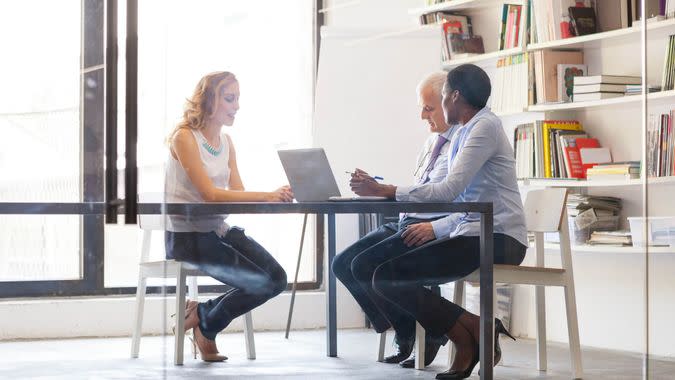 Job Interview with young female candidate in modern office.