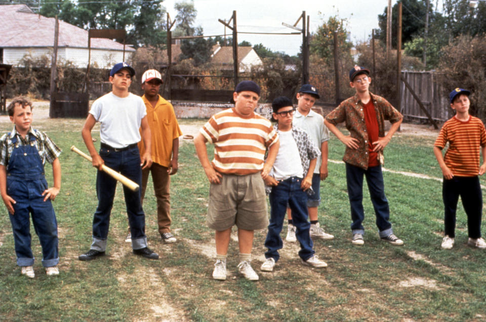 Group of children on a baseball field from "The Sandlot" movie, 1993