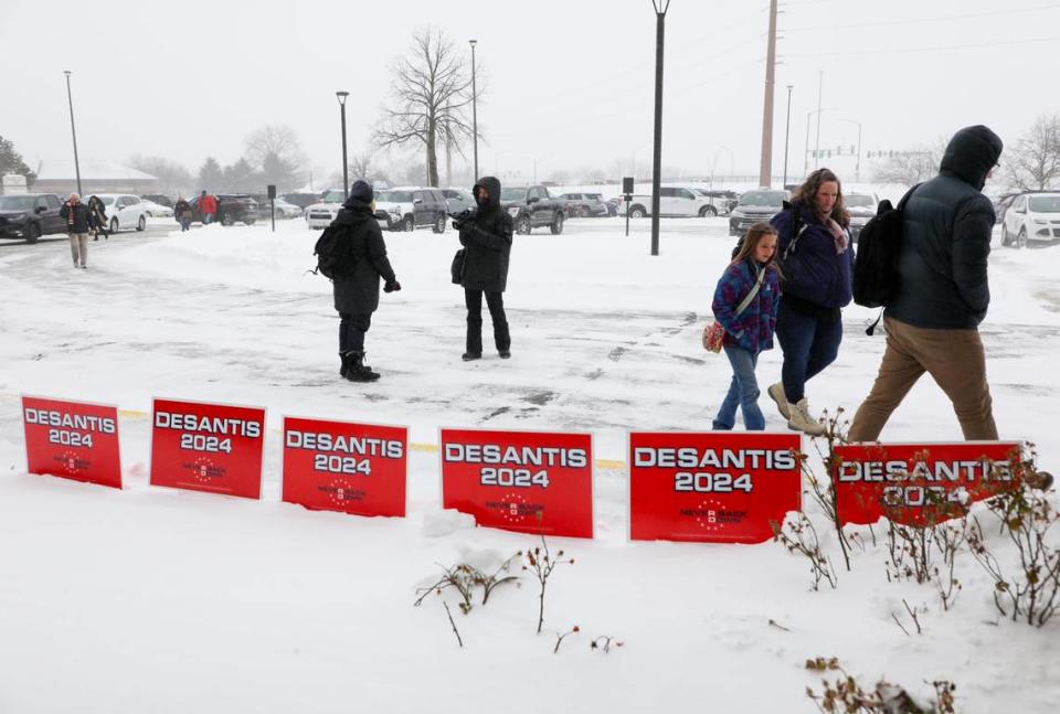 People arrive at the Never Back Down super PAC headquarters where Florida Gov. Ron DeSantis attended a rally on Saturday, Jan 13, 2023, in West Des Moines, IA.