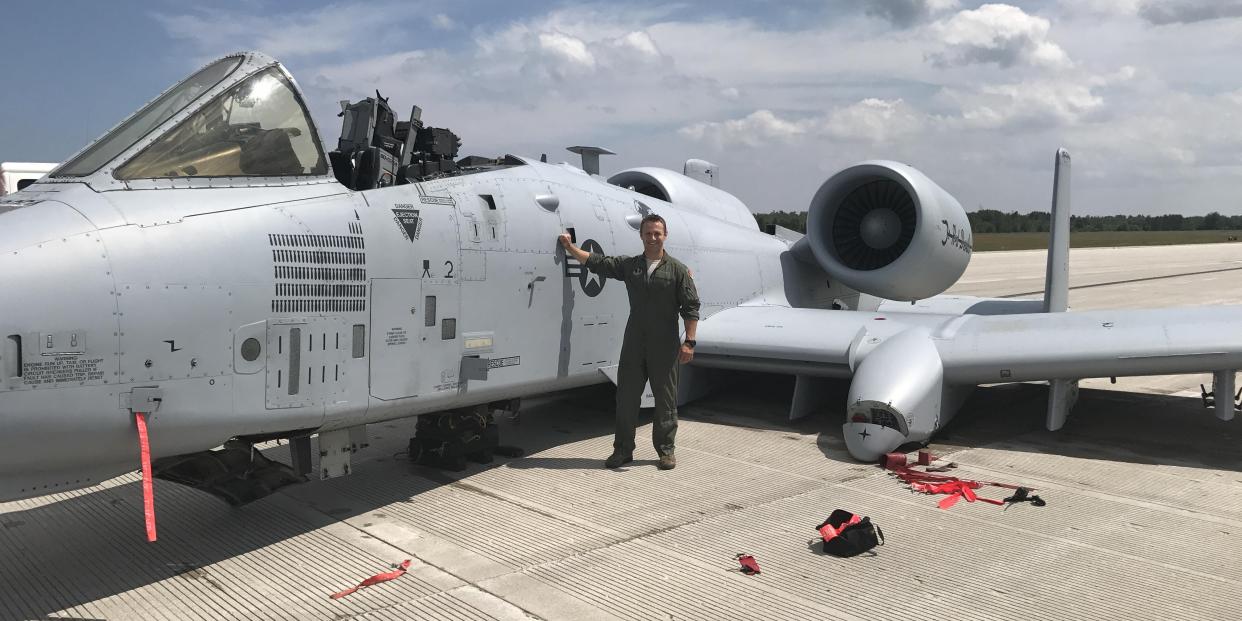 Then-Capt. Brett DeVries, an A-10 Thunderbolt II pilot of the 107th Fighter Squadron from Selfridge Air National Guard Base, next to the aircraft he safely landed after a malfunction forced him to make an emergency landing July 20, 2017